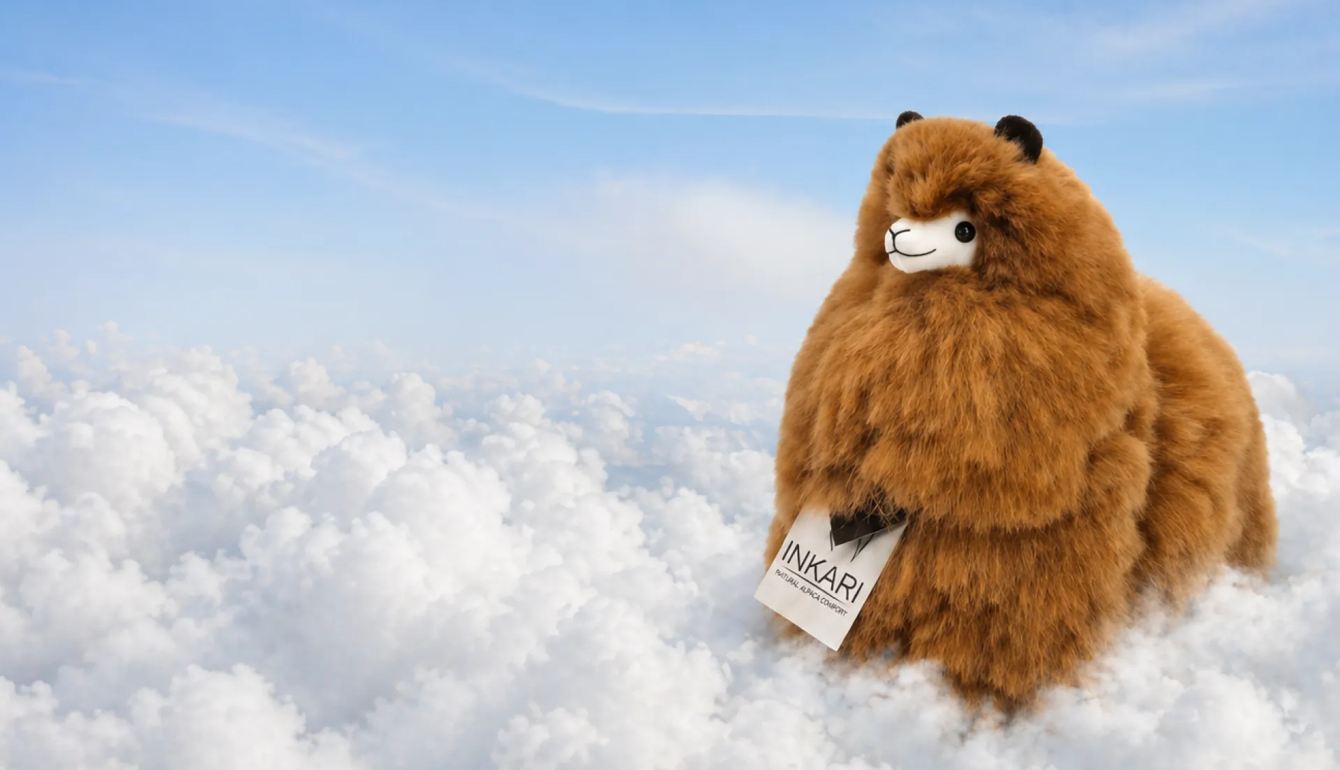 An Inkari plush alpaca standing above the clouds
